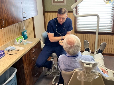 Dr. Till discussing gum disease treatment options with a patient