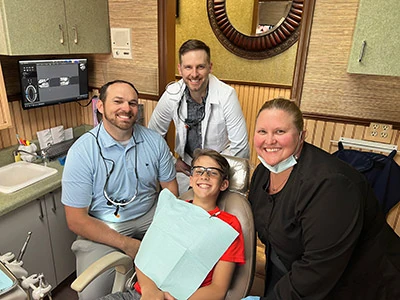 The friendly staff at Georgia Dental Studio with an orthodontics patient