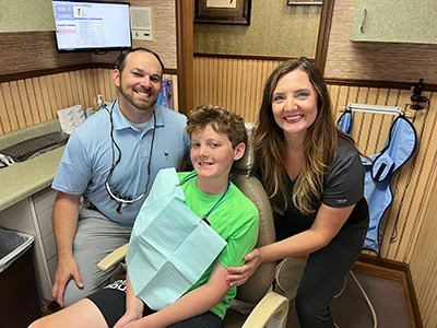 Doctor and dental assistant with orthodontics patient at Georgia Dental Studio