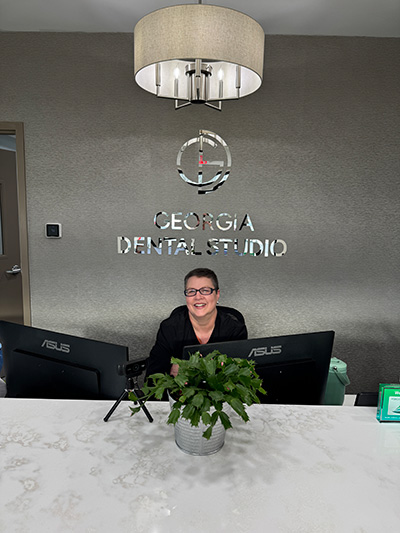 Renae at the front desk welcoming a new patient
