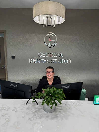 Renae at the front desk welcoming a new patient