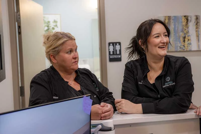 The friendly staff at Georgia Dental Studio greeting patients at the front office in Jersey GA.