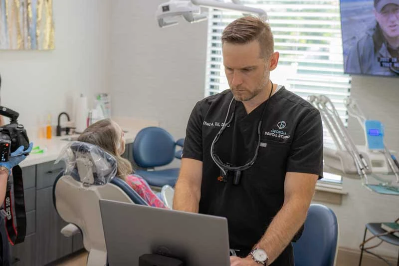 Dr Till reviewing a restorative procedure at Georgia Dental Studio.
